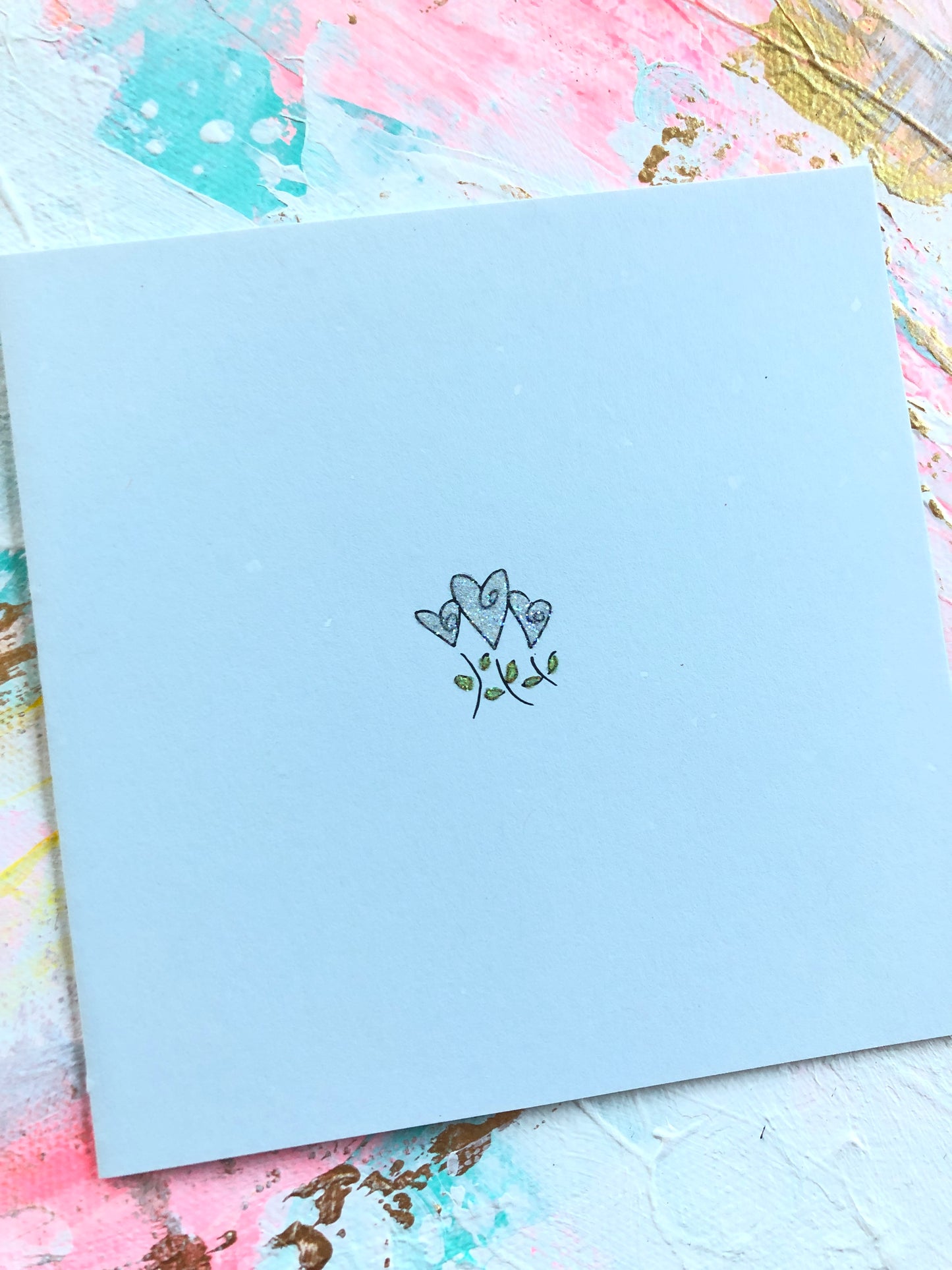 Trio of heart flowers greeting card